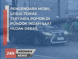 PENGENDARA MOBIL LEXUS TEWAS TERTIMPA POHON DI PONDOK INDAH SAAT HUJAN DERAS.